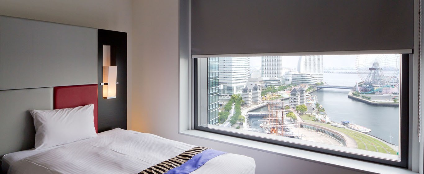 bedroom interior with roller blinds